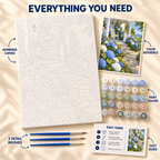 Hydrangea Cottage paint by numbers kit showing numbered canvas, paint pots, three brushes, reference and guide