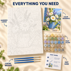 Daisy Watering Can paint by numbers kit showing numbered canvas, paint pots, three brushes, reference and guide
