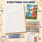 Hummingbird Hibiscus paint by numbers kit showing numbered canvas, paint pots, three brushes, reference and guide