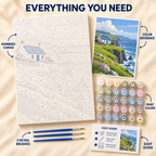 Cliffside Cottage paint by numbers kit showing numbered canvas, paint pots, three brushes, color reference and painting guide