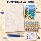 Coastal Watchtower paint by numbers kit showing numbered canvas, paint pots, three brushes, color reference and painting guide
